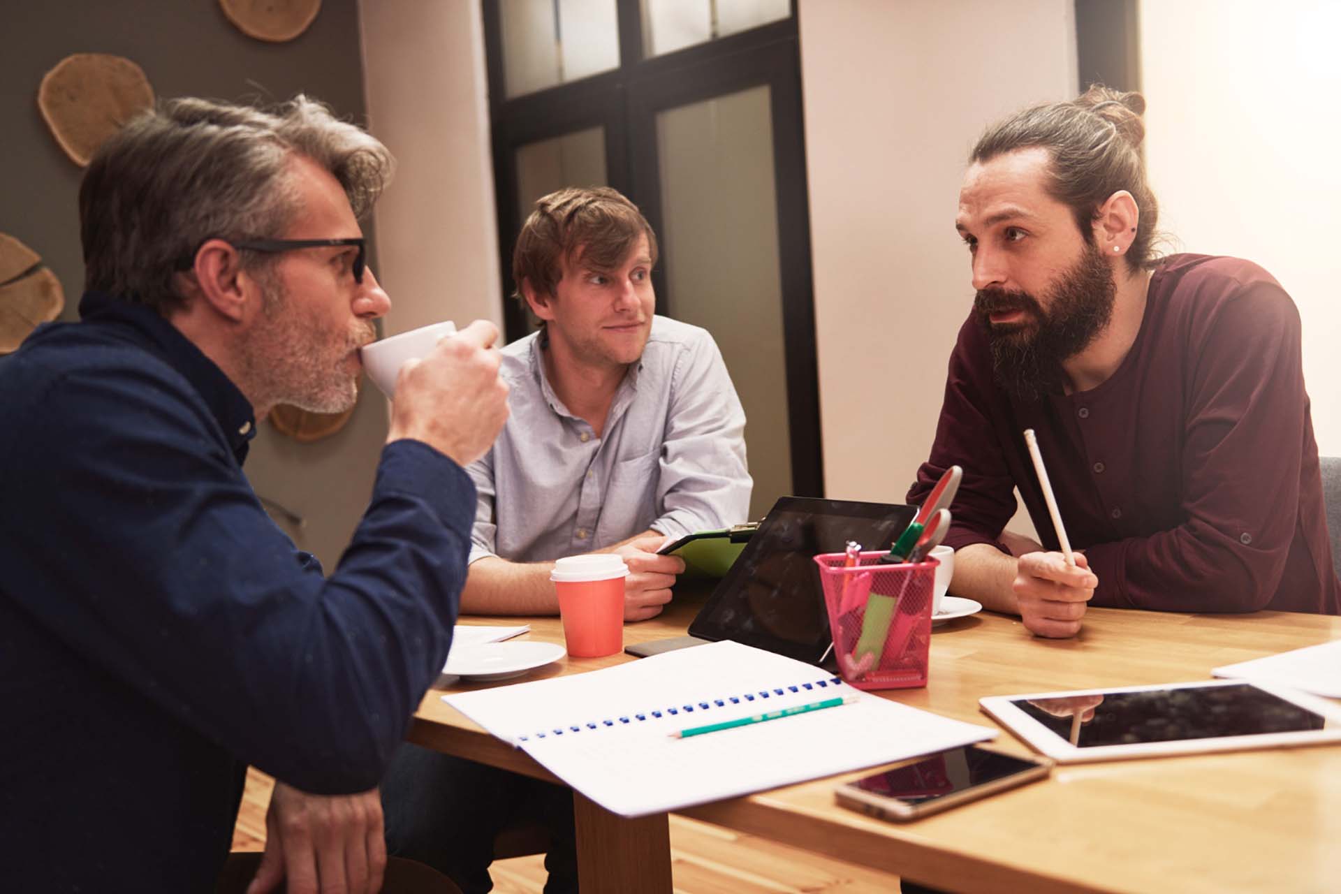 group of creative people analyzing the result of work